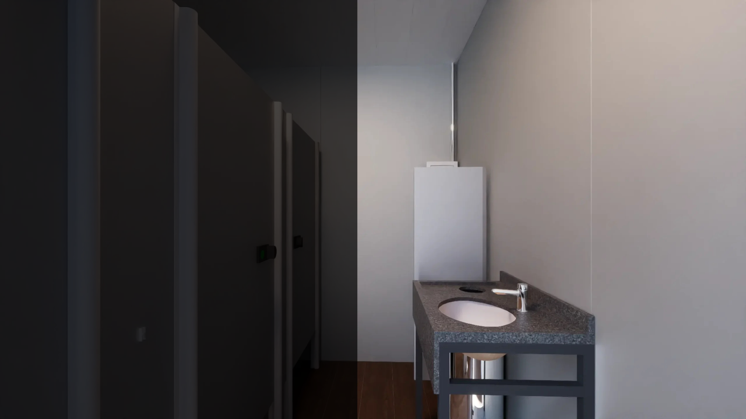 Interior de banheiro modular com cabines privativas escuras e bancada de pedra cinza com cuba branca.